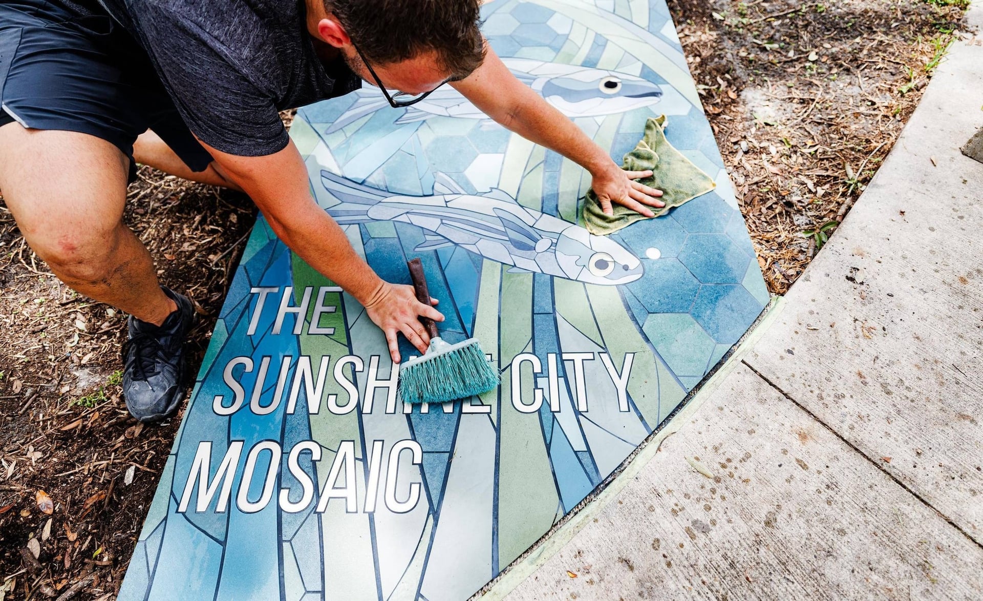 Work on the Sunshine City Mosaic, in the city’s photograph accompanying its Public Art Archive announcement.