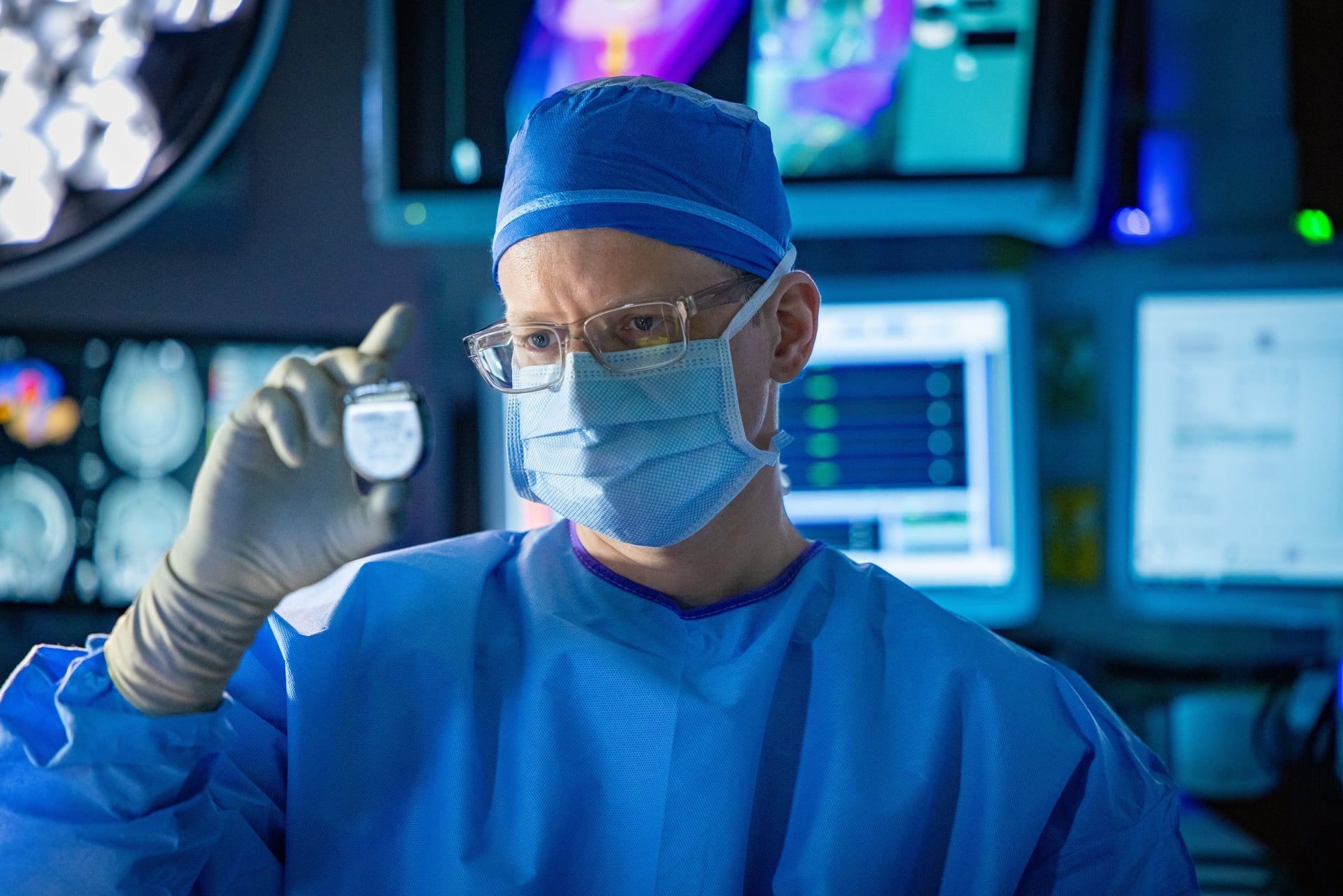 Dr. Yarema Bezchlibnyk and an operating-room team using an O-Arm, in TGH’s official file photograph.